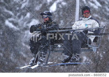 winter fun on a chair lift winter fun on a chair lift 6608552