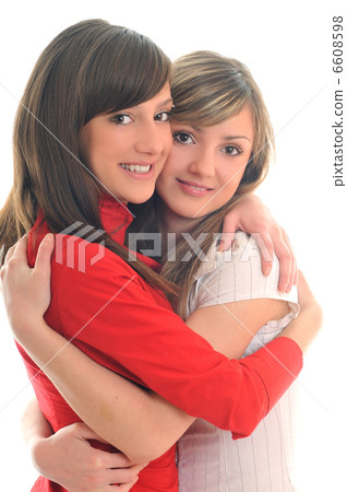 two young girls isolated on white two young girls isolated on white 6608598