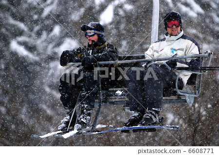 winter fun on a chair lift 6608771