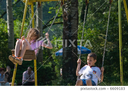 happy girl swinging 6609183