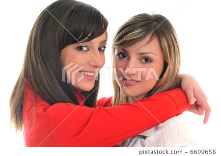 two young girls isolated on white two young girls isolated on white 6609658