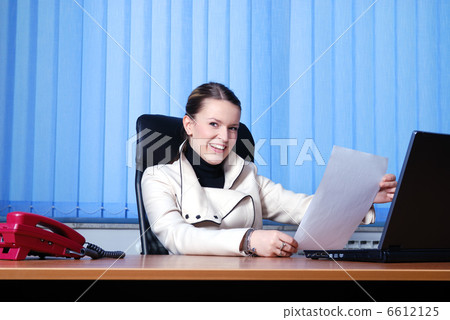 .young businesswoman reading documents .young businesswoman reading documents 6612125