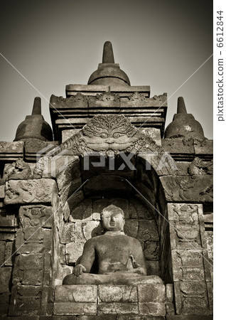 Buddha statue at Borobudur temple, Java, Indonesia Buddha statue at Borobudur temple, Java, Indonesia 6612844