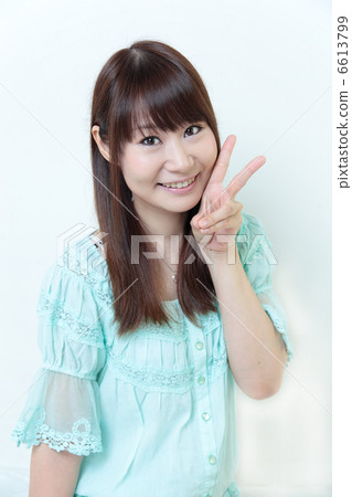 Young woman peace sign Young woman peace sign 6613799