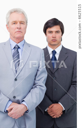 Mature businessman with his colleague 6625515