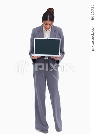 Female entrepreneur looking at her laptop in her hands 6625723