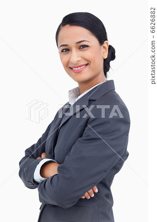 Close up of smiling saleswoman with arms crossed 6626882