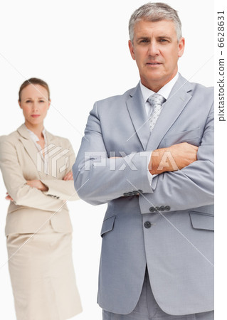 Serious business people standing with folded arms Serious business people standing with folded arms 6628631