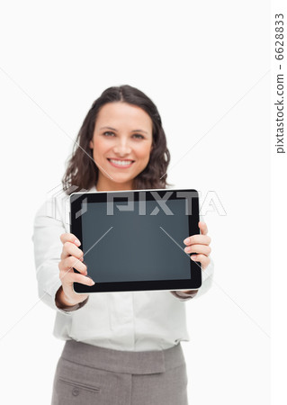 Portrait of a brunette showing a touchpad screen Portrait of a brunette showing a touchpad screen 6628833