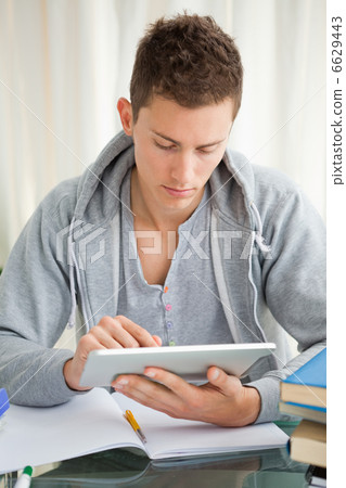 Student using a touch pad Student using a touch pad 6629443
