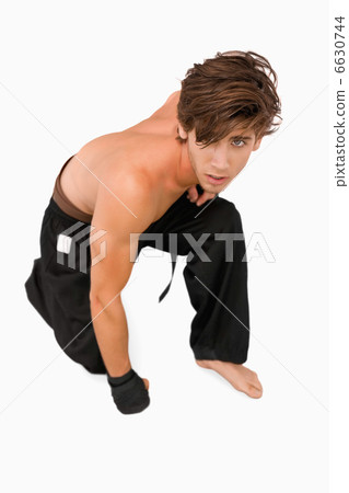 Martial arts fighter kneeling down 6630744