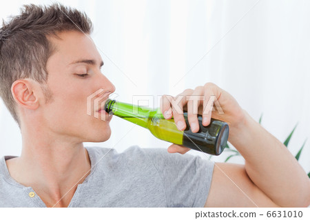 A handsome man drinking some beer 6631010