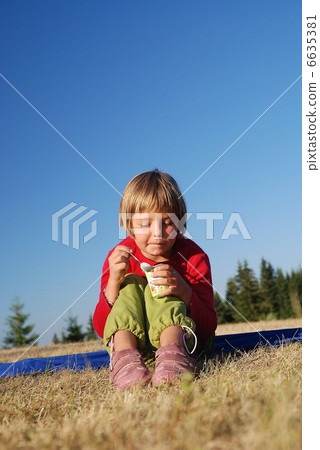 cute little girl eating healthy food outdoor cute little girl eating healthy food outdoor 6635381