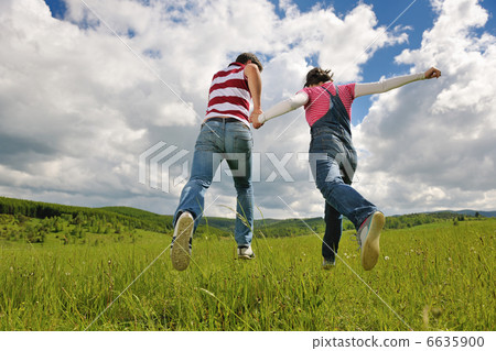 Portrait of romantic young couple smiling together outdoor Portrait of romantic young couple smiling together outdoor 6635900