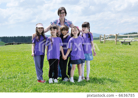 happy kids group with teacher in nature 6636785