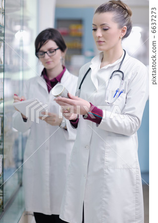 team of pharmacist chemist woman in pharmacy drugstore 6637273