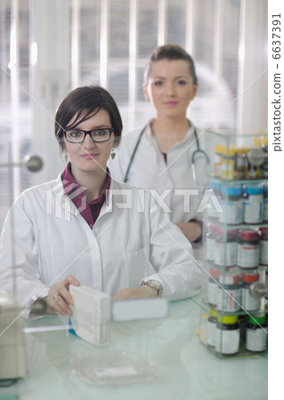 team of pharmacist chemist woman in pharmacy drugstore team of pharmacist chemist woman in pharmacy drugstore 6637391