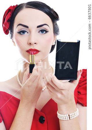 beautiful young woman applying makeup beautiful young woman applying makeup 6637801