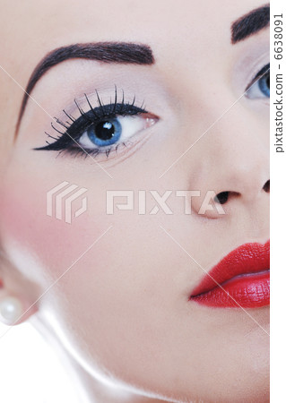 beautiful young woman applying makeup 6638091