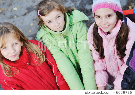 friendship and teamwork concept with young schoolgirls group 6639786