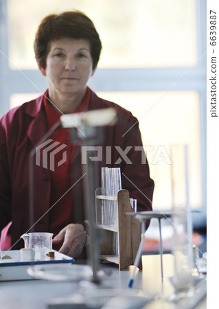 science and chemistry teacher portrait in classroom 6639887
