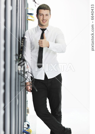young it engeneer in datacenter server room young it engeneer in datacenter server room 6640433