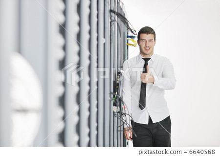 young engeneer in datacenter server room young engeneer in datacenter server room 6640568
