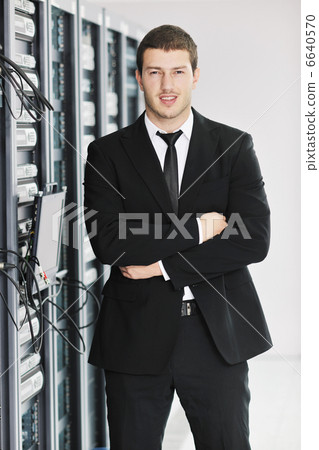 young it engeneer in datacenter server room young it engeneer in datacenter server room 6640570