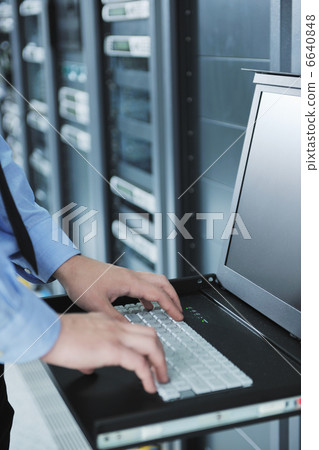 young it engeneer in datacenter server room young it engeneer in datacenter server room 6640848
