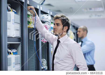 it engineers in network server room 6641018