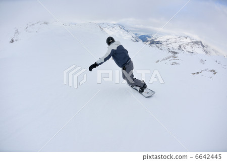 skiing on fresh snow at winter season at beautiful sunny day 6642445