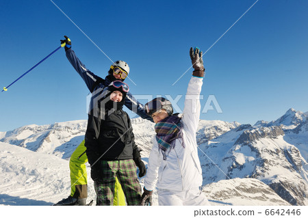 winter portrait of friends at skiing 6642446