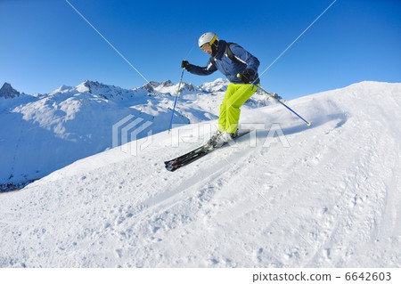 skiing on fresh snow at winter season at beautiful sunny day skiing on fresh snow at winter season at beautiful sunny day 6642603