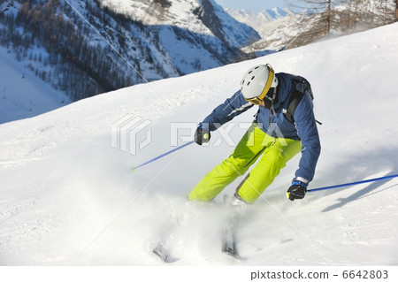 skiing on fresh snow at winter season at beautiful sunny day skiing on fresh snow at winter season at beautiful sunny day 6642803