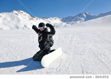 skiing on fresh snow at winter season at beautiful sunny day 6642859