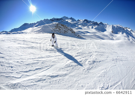 skiing on fresh snow at winter season at beautiful sunny day 6642911