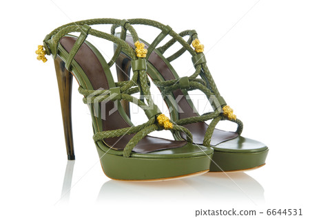 Woman green shoes isolated on white 6644531
