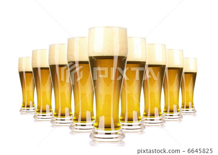 Frosty glass of beer with foam isolated on a white background Frosty glass of beer with foam isolated on a white background 6645825