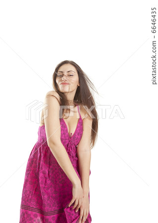 Pretty young girl in red dress posing in studio Pretty young girl in red dress posing in studio 6646435