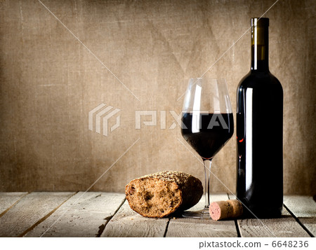 Wine and bread on the table Wine and bread on the table 6648236