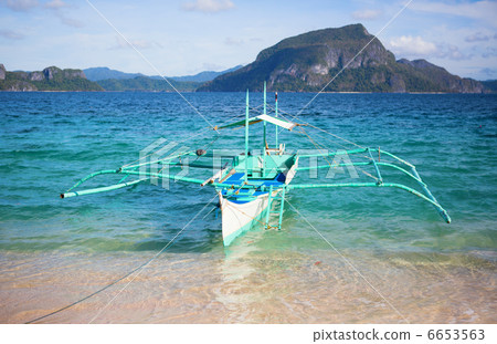 Outrigger boat near the shore on Palawan, Philippines Outrigger boat near the shore on Palawan, Philippines 6653563