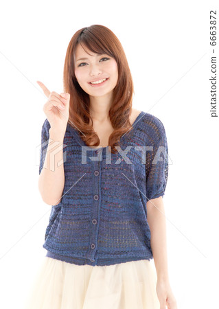 A cute girl pointing your finger with a cute smile 6663872