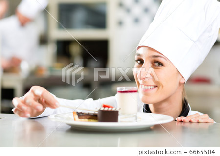 Cook, pastry chef, in hotel or restaurant kitchen 6665504