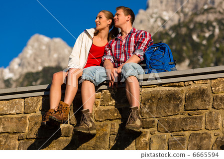 Happy Couple hiking in alp mountains Happy Couple hiking in alp mountains 6665594