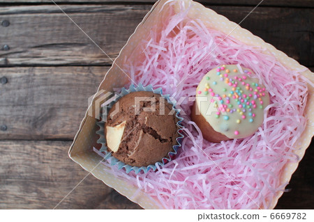 Homemade chocolate-covered decomuffins in a box 6669782