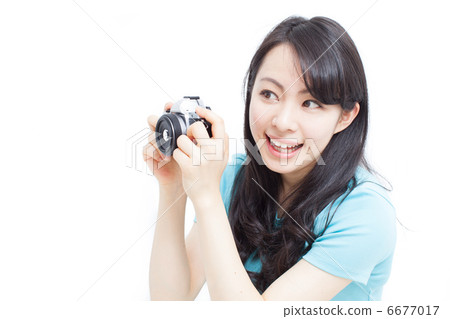 A woman taking a picture 6677017