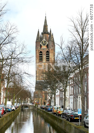 Canal and church tower in Delft, Netherlands Canal and church tower in Delft, Netherlands 6677738
