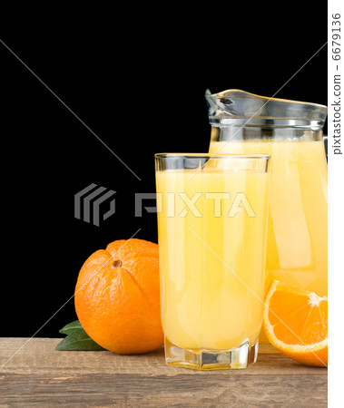 orange juice and fruit  on black 6679136