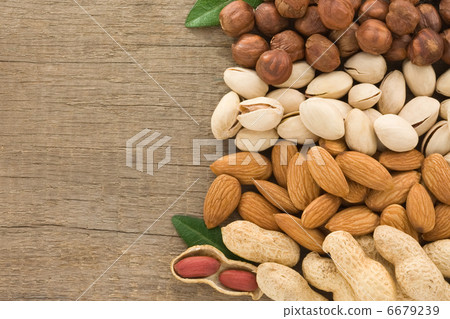 set of nuts fruit on wood background set of nuts fruit on wood background 6679239