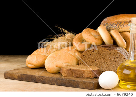 bread and bakery products on wood isolated at black 6679240